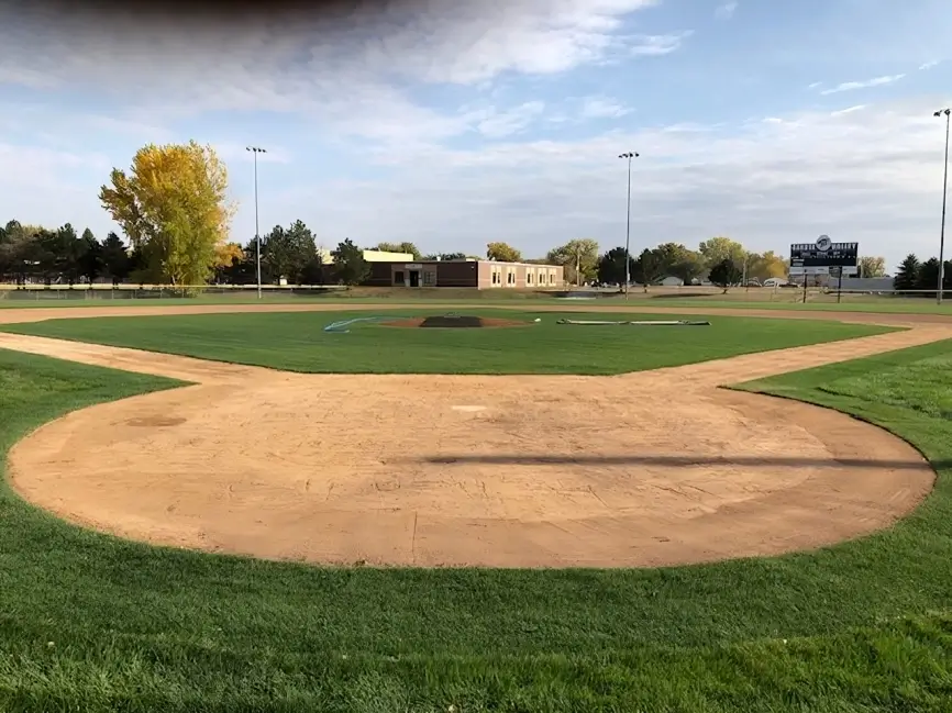 A baseball field with the base ball diamond in view.